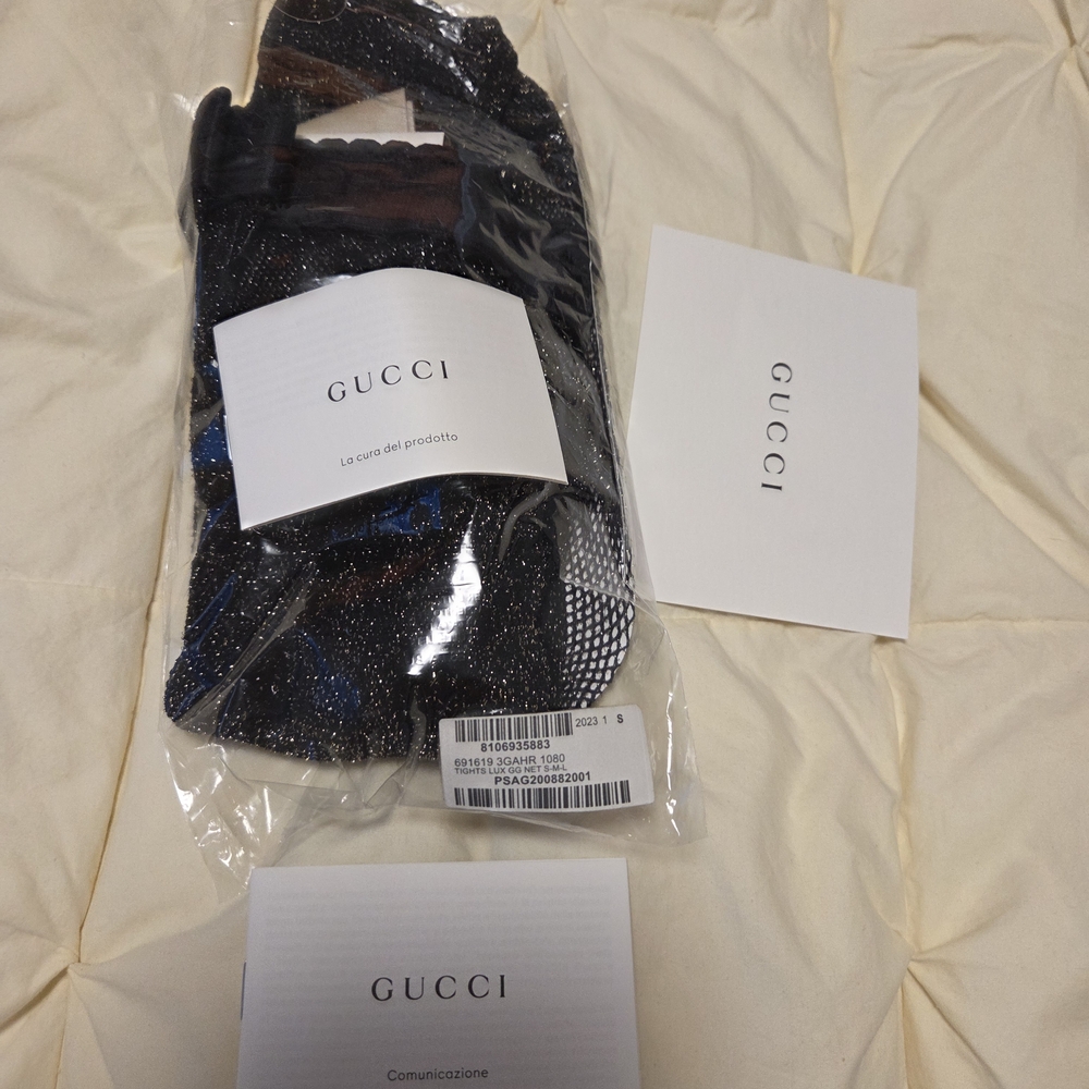 GUCCI BLACK AND GOLD SPARKLE GG TIGHTS.